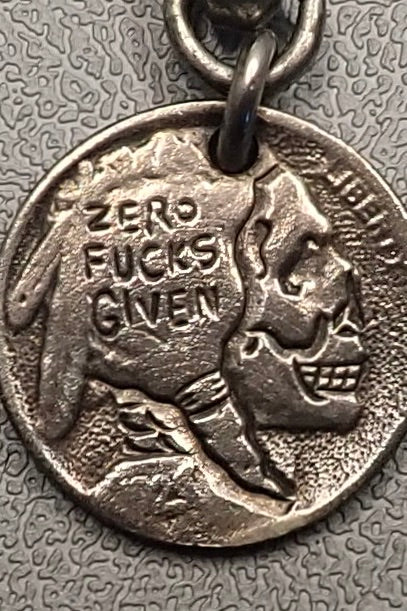 INDIAN SKULL CARVED COIN