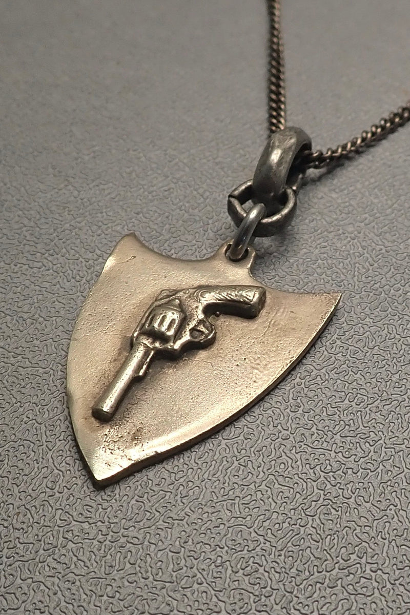 REVOLVER SHIELD PENDANT