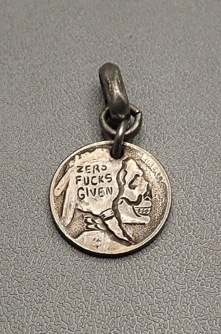 INDIAN SKULL CARVED COIN