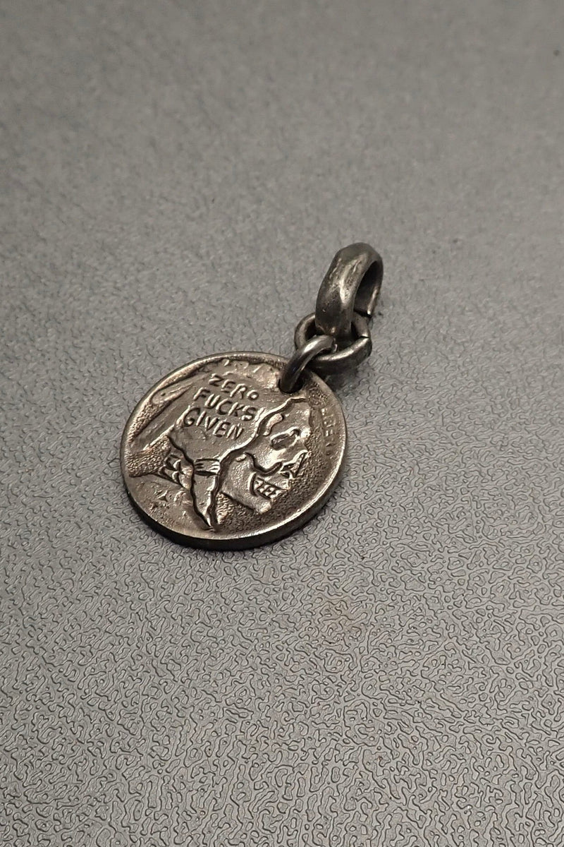 INDIAN SKULL CARVED COIN