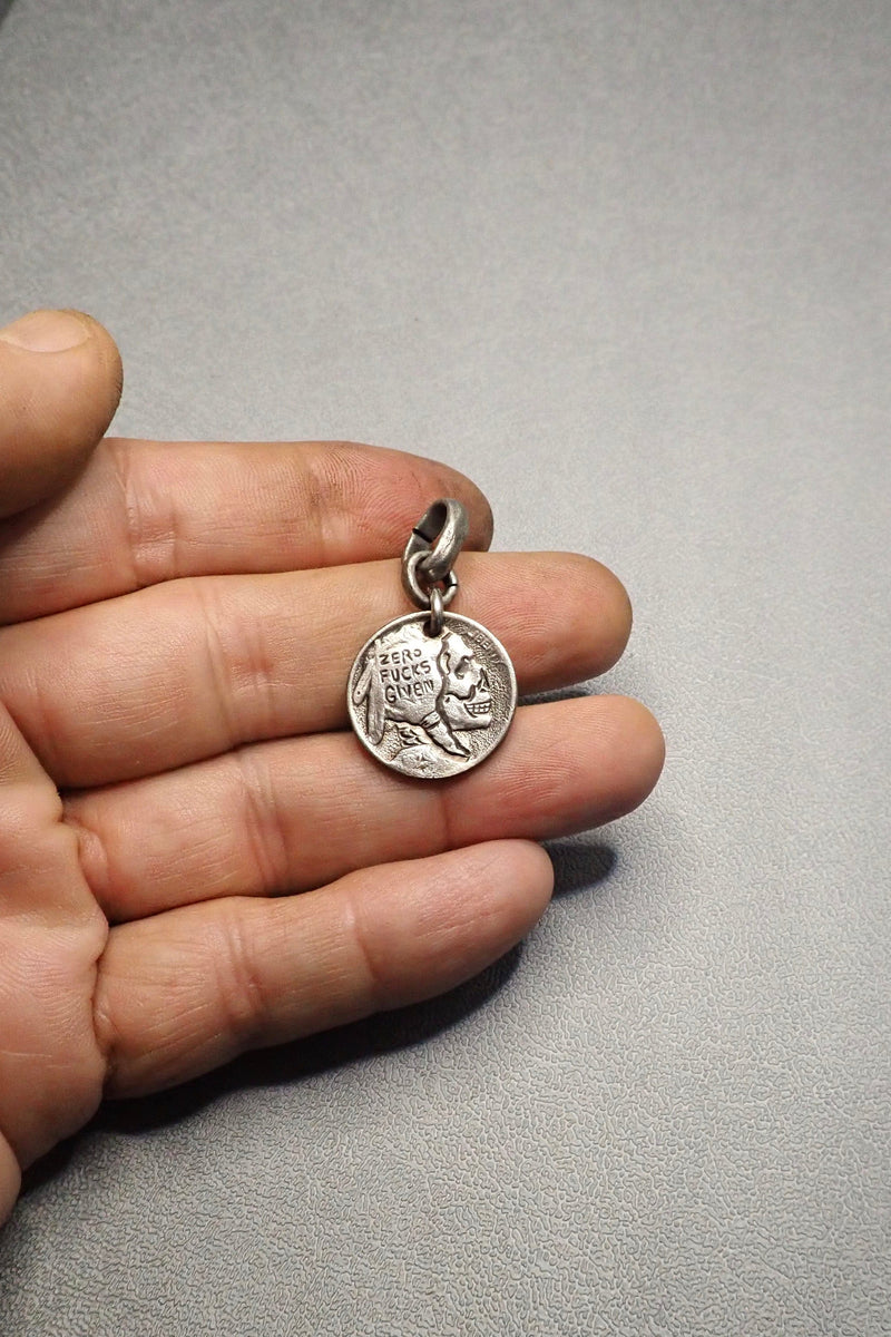 INDIAN SKULL CARVED COIN
