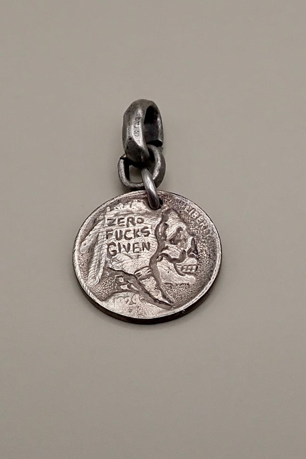 INDIAN SKULL CARVED COIN