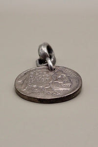 INDIAN SKULL CARVED COIN