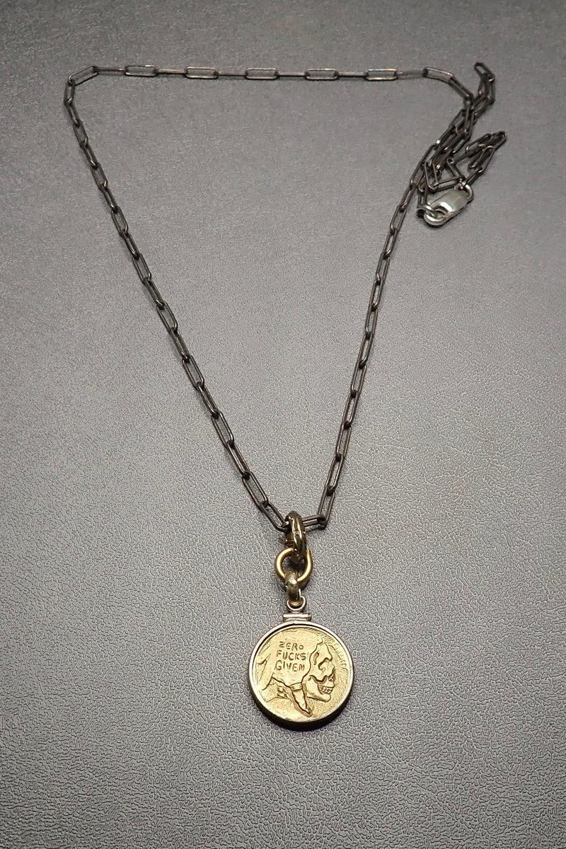 BRONZE CARVED SKULL PENDANT - two made