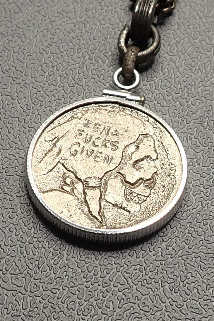 SILVER CARVED SKULL PENDANT