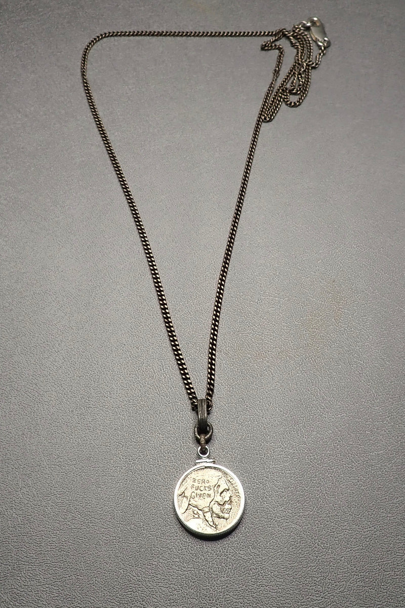 SILVER CARVED SKULL PENDANT