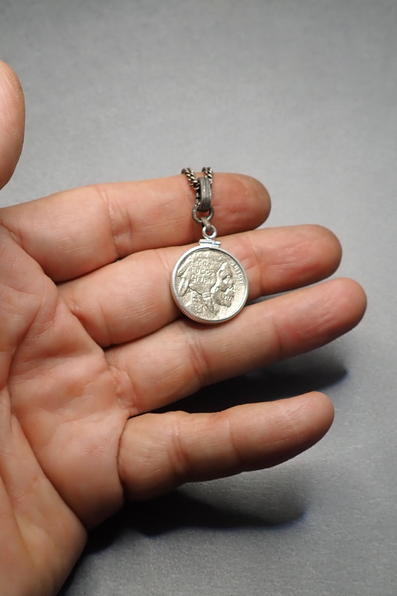 SILVER CARVED SKULL PENDANT