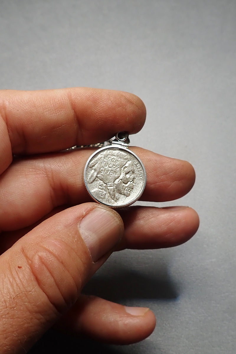 SILVER CARVED SKULL PENDANT