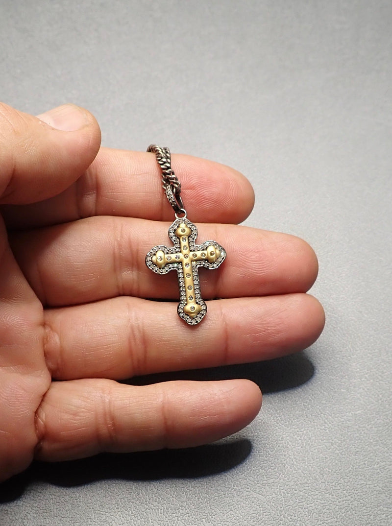 Product named 14 K GOLD/DIAMOND CROSS NECKLACE sold by Dirty Hands Jewelry. The product is a 14 k gold and diamonds cross pendant on an oxidized big silver flat links chain. The product price is $620.00 and the weight is 0.0992 lb.